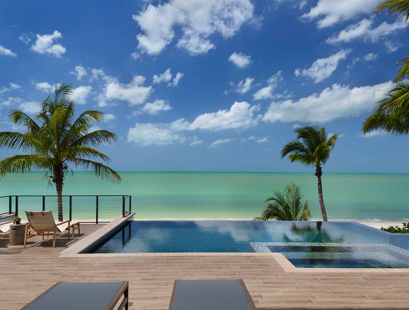 Portfolio of Pools in Naples, Florida Luxury Homes. Oceanfront Infinity Pool. Designed by Kukk Architecture & Design Naples.